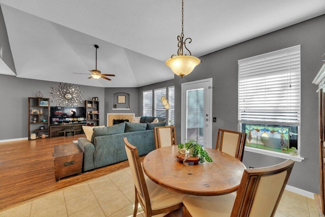 2157 Paradise Ridge Dr, Round Rock, TX 78665 - dining area featuring lofted ceiling, baseboards, a ceiling fan, and light tile patterned floors