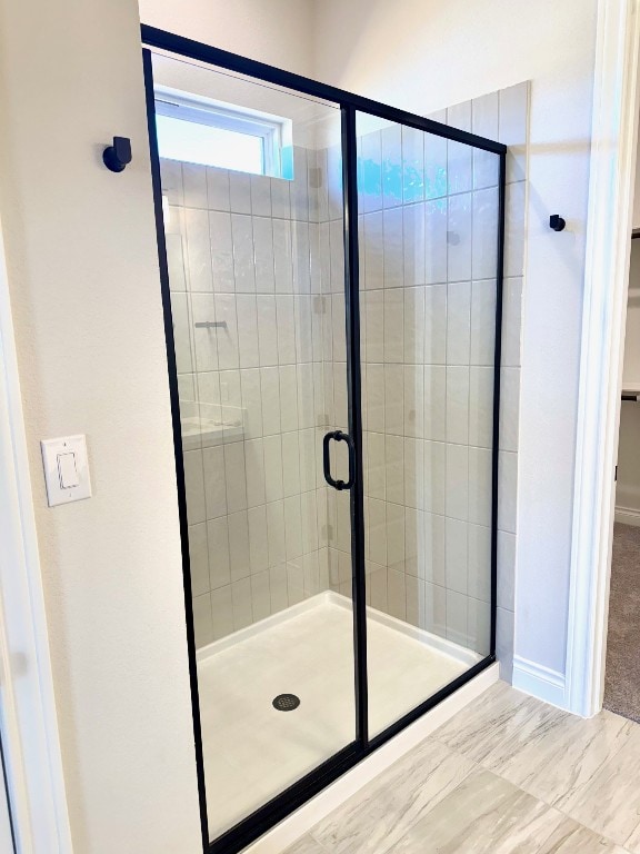 full bath with a shower stall