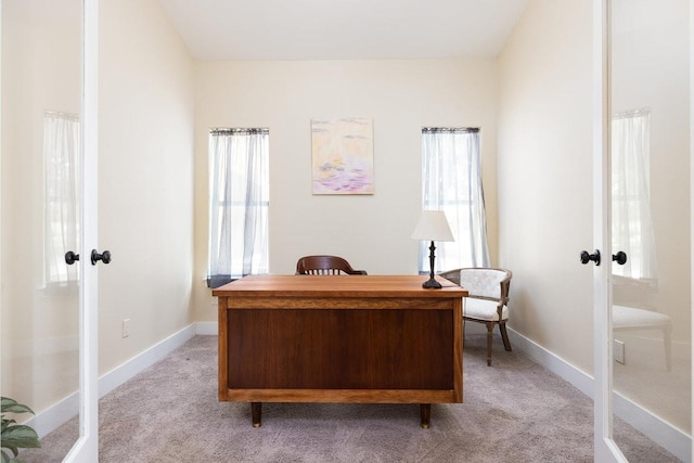 office area with light colored carpet, french doors, and baseboards