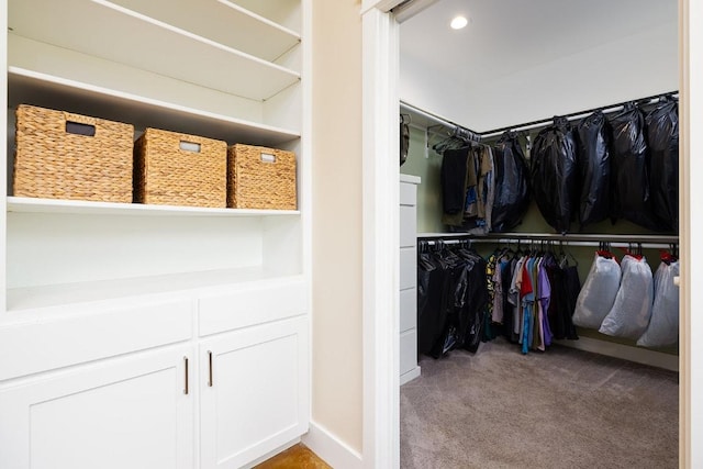 walk in closet featuring carpet