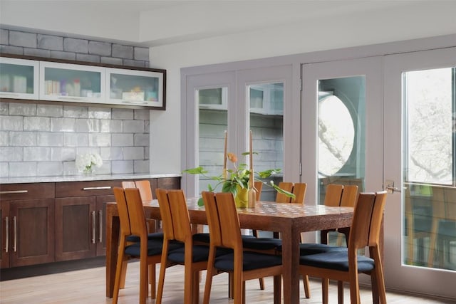 dining room featuring a wealth of natural light and light wood finished floors