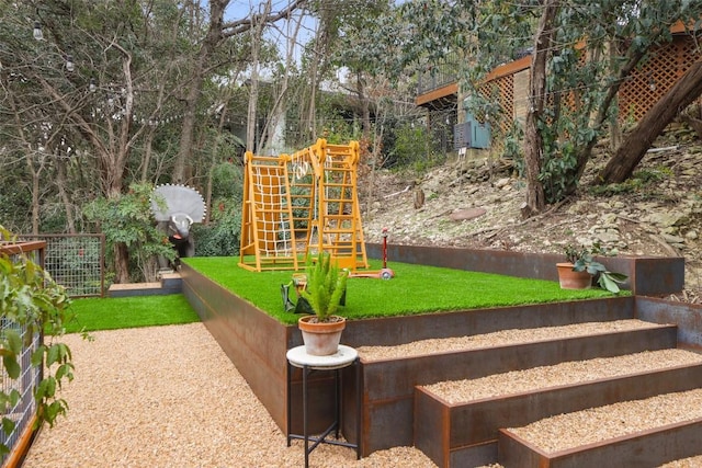 view of playground featuring a lawn