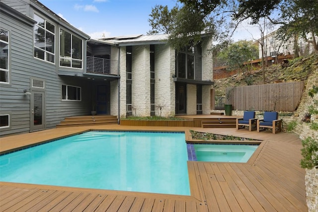 outdoor pool featuring a patio area and fence