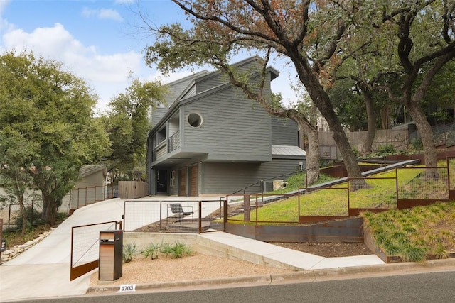 view of front of home featuring fence private yard