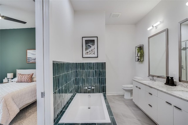 full bath with visible vents, double vanity, a sink, toilet, and a bathtub