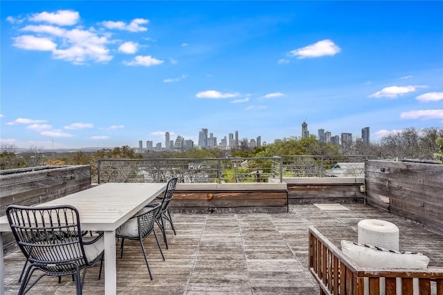 wooden terrace with a city view