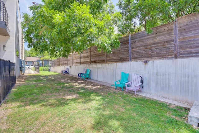 view of yard with a fenced backyard