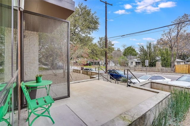 view of patio / terrace featuring fence