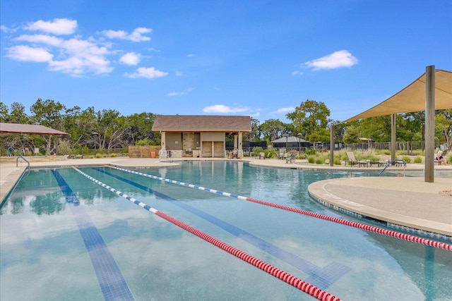 pool featuring a patio and fence