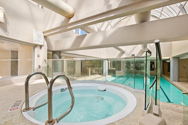 pool with an indoor in ground hot tub