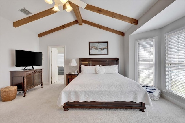 bedroom featuring visible vents, light carpet, baseboards, and vaulted ceiling with beams