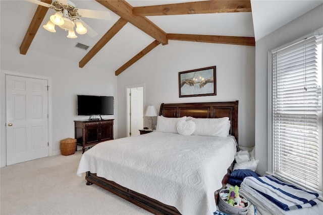 bedroom with visible vents, carpet floors, multiple windows, and vaulted ceiling with beams