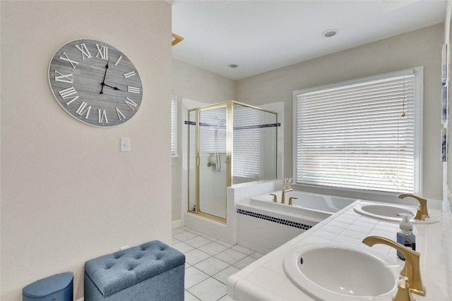 bathroom with tile patterned flooring, a shower stall, radiator, a garden tub, and a sink