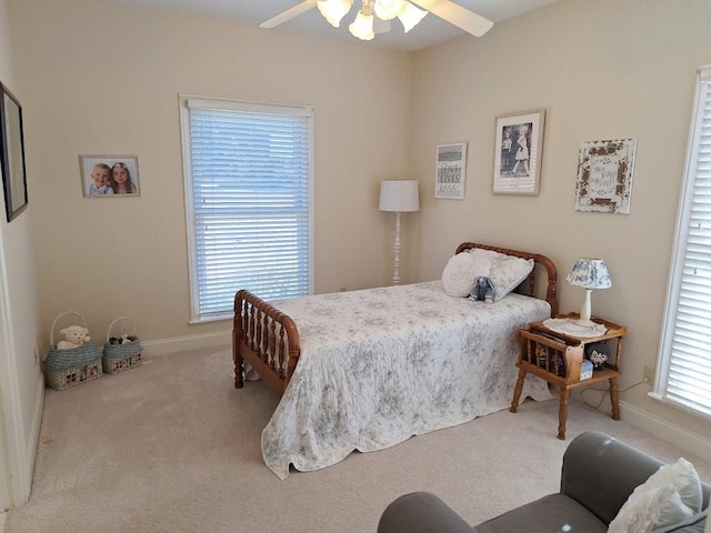 bedroom with baseboards, ceiling fan, and carpet floors