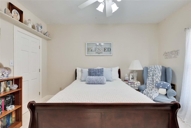 bedroom with baseboards and ceiling fan