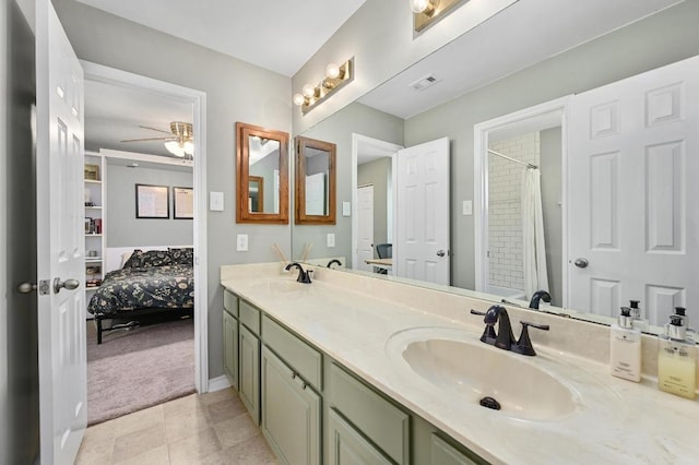 full bath featuring a sink, visible vents, ceiling fan, and double vanity