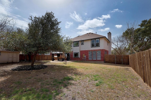 view of yard featuring a gazebo, an outdoor structure, a fenced backyard, and a shed