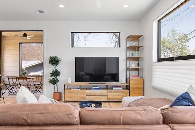 living area featuring recessed lighting, visible vents, wood finished floors, and a ceiling fan