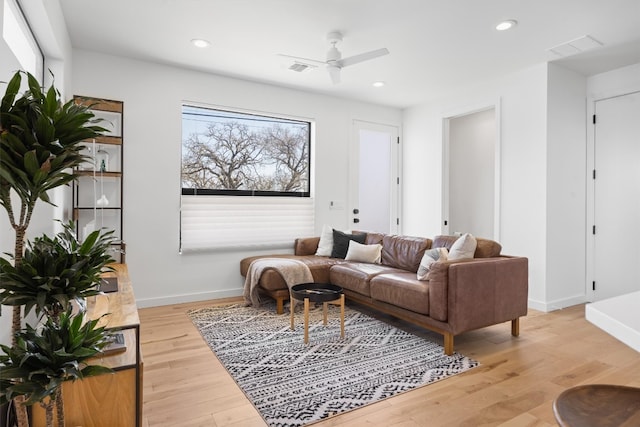 living area featuring visible vents, recessed lighting, baseboards, and light wood-style floors