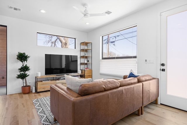 living room featuring recessed lighting, visible vents, a ceiling fan, and light wood finished floors