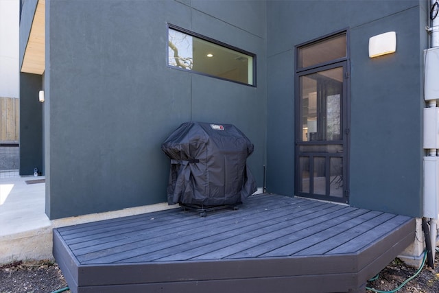 deck featuring a grill