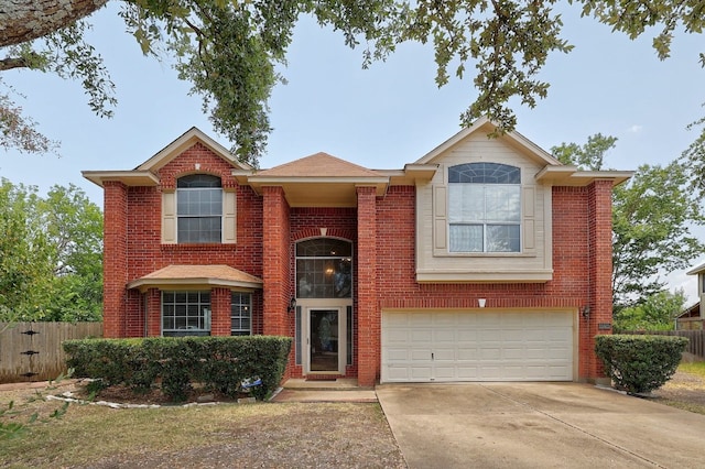 view of front of home featuring a garage, brick siding, driveway, and fence