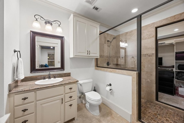 bathroom featuring vanity, toilet, and a stall shower