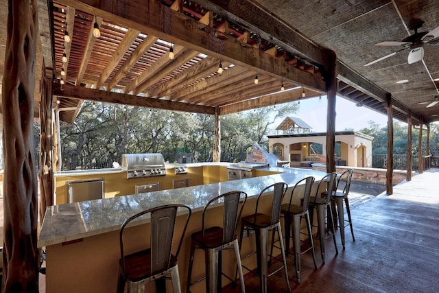 view of patio / terrace featuring area for grilling, a pergola, grilling area, outdoor wet bar, and ceiling fan