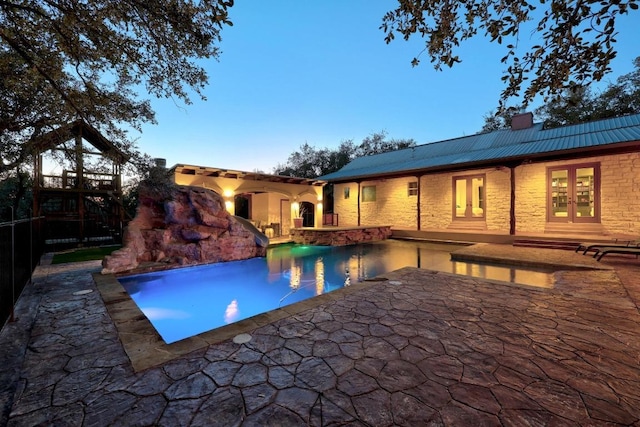 pool featuring a patio and french doors