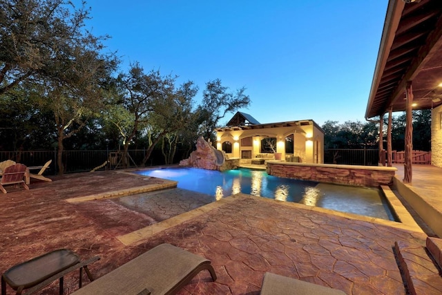 view of swimming pool with a fenced in pool, a fenced backyard, and a patio area