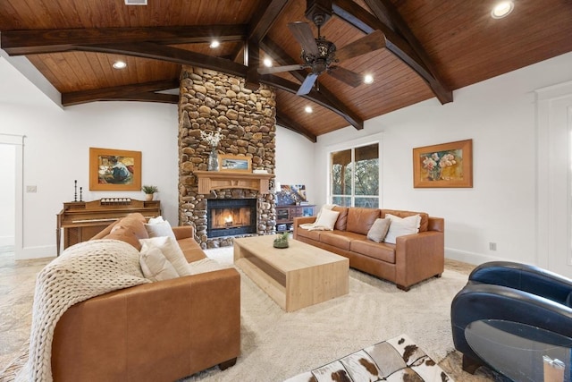 living room with a stone fireplace, wood ceiling, and baseboards