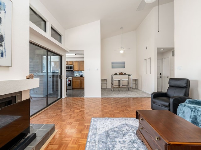 8200 Neely Dr Unit 251, Austin, TX 78759 - living area featuring ceiling fan, high vaulted ceiling, and baseboards