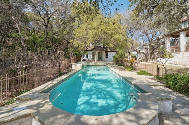 view of pool with a fenced in pool, an outbuilding, fence private yard, and a patio area