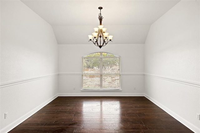 unfurnished dining area featuring lofted ceiling, baseboards, wood-type flooring, and a chandelier