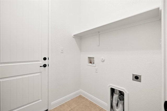 washroom with washer hookup, light tile patterned floors, laundry area, hookup for a gas dryer, and hookup for an electric dryer