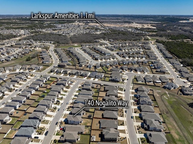 birds eye view of property with a residential view