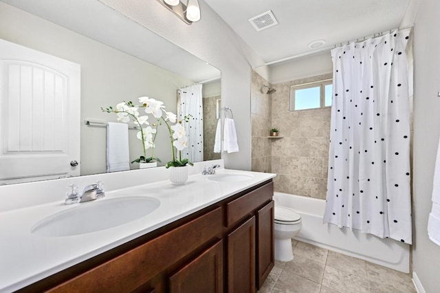 full bath featuring visible vents, shower / bathtub combination with curtain, toilet, and a sink