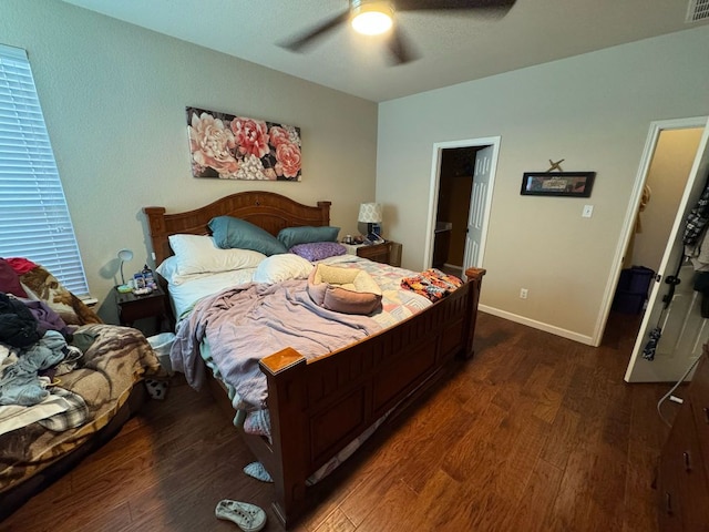 bedroom with wood finished floors, baseboards, and ceiling fan