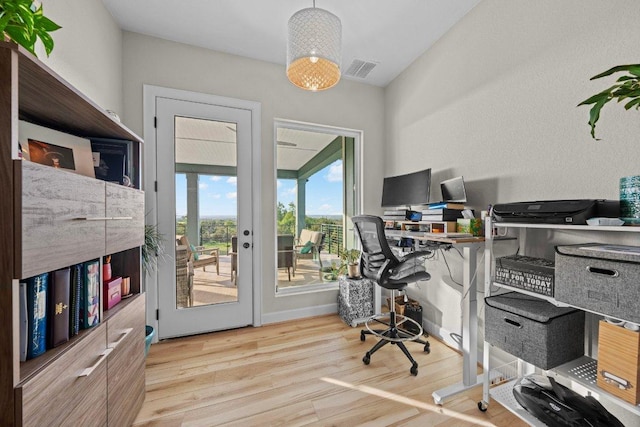 home office featuring wood finished floors and visible vents