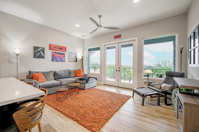 living area with visible vents, light wood-style flooring, a ceiling fan, recessed lighting, and french doors