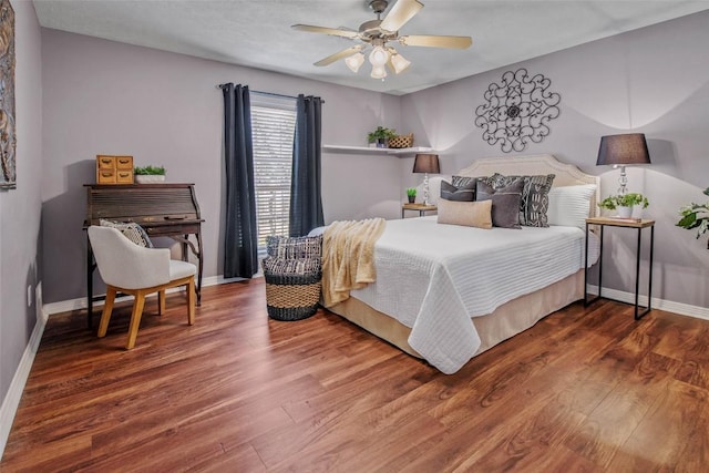 bedroom featuring wood finished floors, baseboards, and ceiling fan