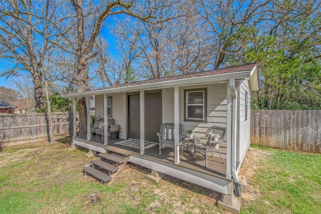 view of outbuilding with fence