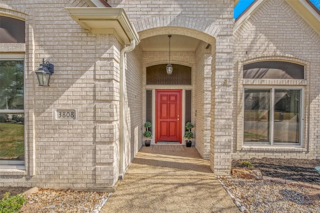 entrance to property with brick siding