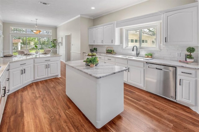 kitchen with visible vents, light wood-style flooring, dishwasher, and a sink