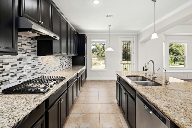 kitchen featuring visible vents, ornamental molding, under cabinet range hood, a sink, and stainless steel appliances