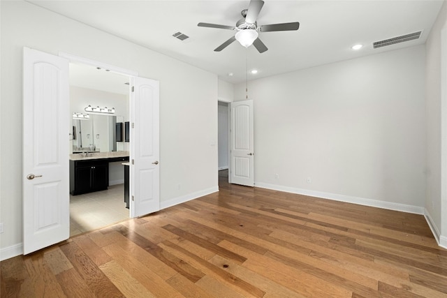 unfurnished bedroom with recessed lighting, visible vents, baseboards, and light wood-style floors