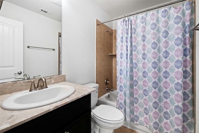 bathroom featuring vanity, shower / bathtub combination with curtain, visible vents, toilet, and a textured wall