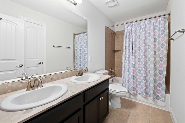 bathroom featuring tile patterned flooring, shower / bath combination with curtain, visible vents, and a sink