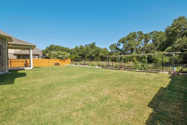 view of yard featuring a fenced backyard