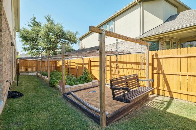 view of yard featuring a vegetable garden and a fenced backyard